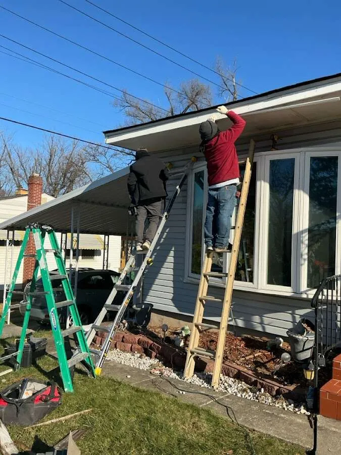 Restoration crew performing exterior repair in Fostoria